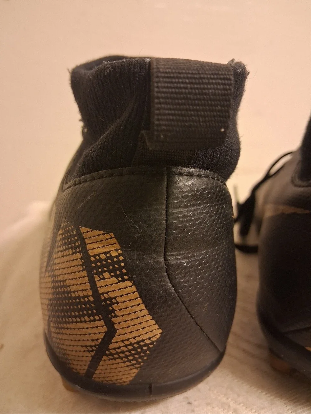 Youth Nike Black Cleats with Gold Swoosh Size 5Y